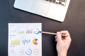 Small business owner reviewing local SEO reporting KPIs for Google Ads campaigns on a WordPress website