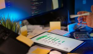 Checklist of essential WooCommerce plugins displayed on a laptop screen for online store management