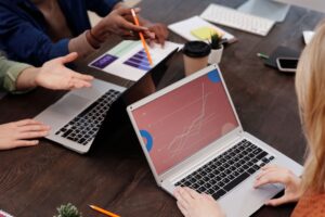 Business owner optimizing WordPress website redesign SEO checklist for Google Ads lead growth on laptop